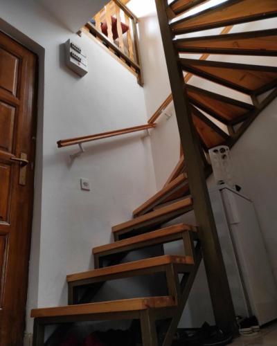 a set of wooden stairs in a room at B&E vikendica in Spile