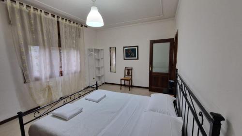 Ένα ή περισσότερα κρεβάτια σε δωμάτιο στο Carossa Apartment