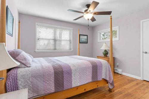 a bedroom with a bed and a ceiling fan at Cozy Retreat Amidst Serene Nature- A Perfect Getaway in Porter