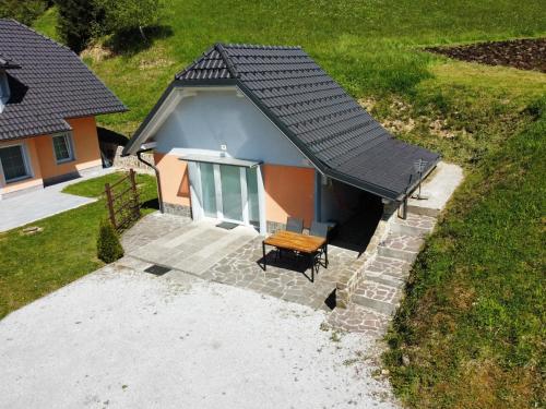 an overhead view of a house with a wooden table at Apartment Ozebek in Cerkno