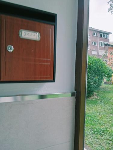 a door with a sign that says exit at pension Tolima in Cabezón de la Sal