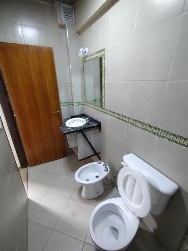 a bathroom with a toilet and a sink at Pleno centro con cochera in San Salvador de Jujuy