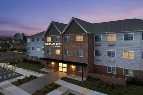 a building with a sign that reads massage elite therapy at TownePlace Suites by Marriott Annapolis in Annapolis