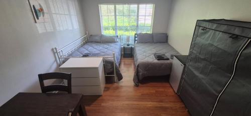 a small living room with a bed and a couch at Everything Bigger in texas in Houston