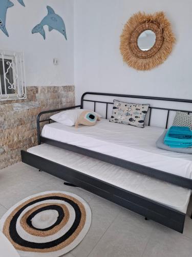 a bedroom with two bunk beds and a rug at Vitamin Sea house in Panayía