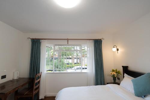 Кровать или кровати в номере United House Nairobi