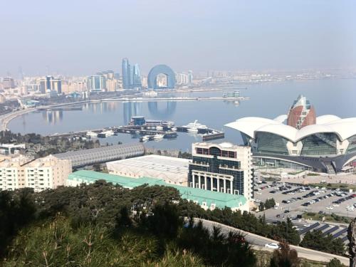 a view of a city with a body of water at Хорошем месте находится, улица Иззет Небиев 6-22 in Baku