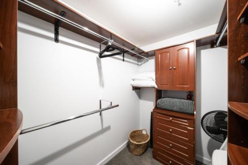 a small bathroom with a window and a closet at Modern Downtown Top Floor Penthouse With Bay Views in Seattle