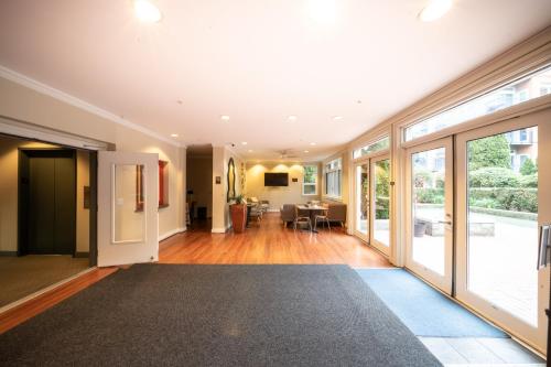 an open living room with sliding glass doors at Modern Downtown Top Floor Penthouse With Bay Views in Seattle