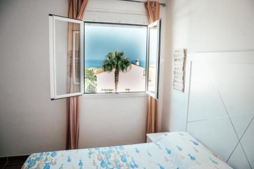 Ένα ή περισσότερα κρεβάτια σε δωμάτιο στο Casa Serena