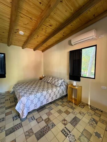 a bedroom with a bed in a room at Posada San Marcos in San Marcos Sierras