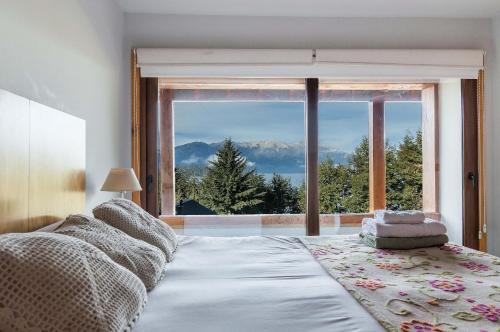 Postel nebo postele na pokoji v ubytování Atardeceres del Lago - Alojamientos con Vista al Lago Villa La Angostura