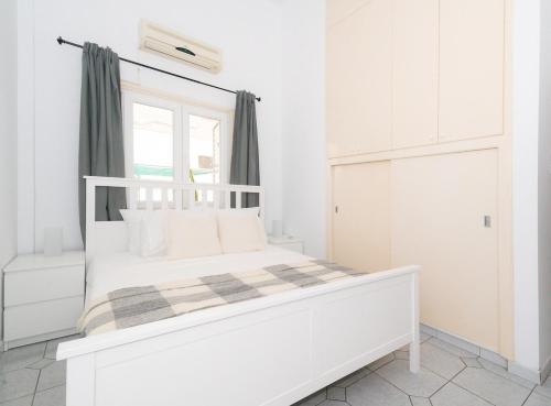 Ένα ή περισσότερα κρεβάτια σε δωμάτιο στο Cosy Downtown Apartment
