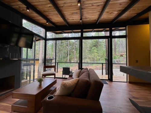 Posezení v ubytování Cabañas del Bosque 1