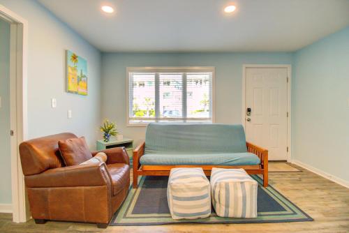 a living room with a couch and a chair at Next Time Down by Carolina Beach Realty in Kure Beach