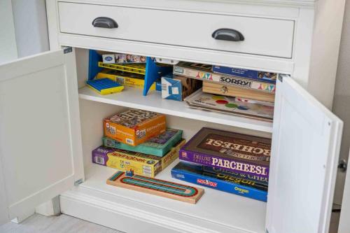 a drawer filled with books and other books at The Nedonna Nest in Rockaway Beach