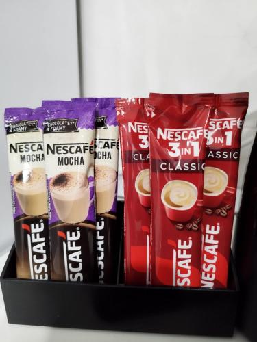 a box filled with different types of coffee drinks at Tolj apartman in Ljubuški