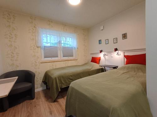 Tempat tidur dalam kamar di Guesthouse Kohvikann