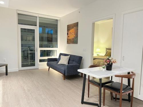 a living room with a couch and a table at Best location &comfortable room1B &1B Richmond center in Richmond