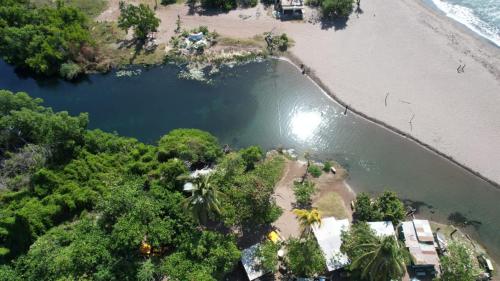an aerial view of a beach next to the water at Royal View Villa in Bull Savanna