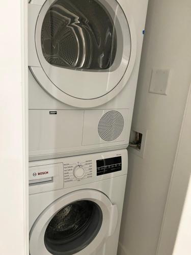 a washing machine and a dryer in a room at Best location &comfortable room1B &1B Richmond center in Richmond