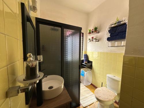 a bathroom with a sink and a shower with a toilet at TITOS HOME 2 suite in Morelia