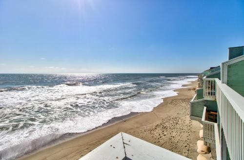 a view of the ocean from the balcony of a beach at Ocean Dunes 1504 by Carolina Beach Realty in Kure Beach