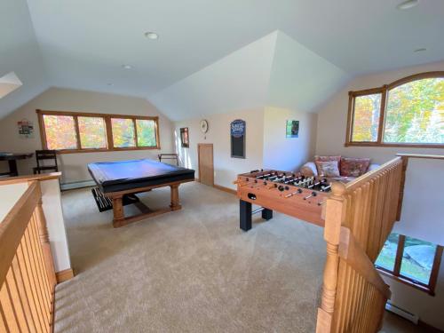 a living room with a foosball table and a pool table at Spacious private home - AL132 in Carroll