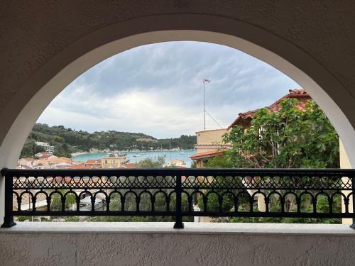 an archway view of a river from a balcony at ERIDA Accommodation in Lákka