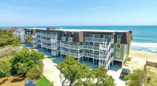 an aerial view of a building on the beach at Ocean Dunes 2124C- Bella Vista by Carolina Beach Realty in Kure Beach