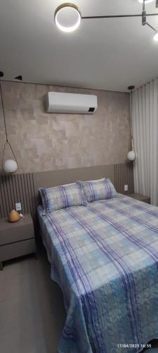 Ένα ή περισσότερα κρεβάτια σε δωμάτιο στο Linda casa com piscina