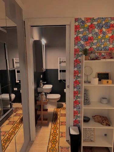 a bathroom with a toilet and a sink at Da Luis 5 Terre in La Spezia