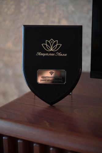 a black box sitting on top of a wooden table at Apartman Milja in Požega