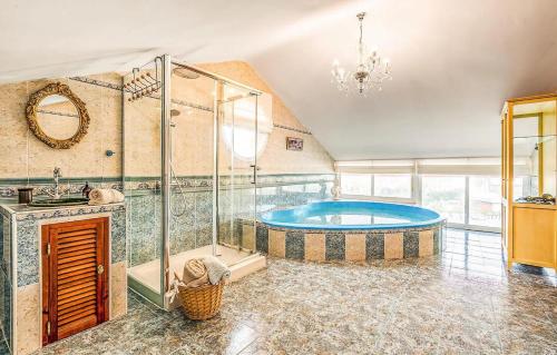 a large bathroom with a tub and a shower at Majestic Villa by the Beach Heated Private Pool & Jacuzzi in Benalmádena