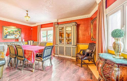 a dining room with a table and chairs at Majestic Villa by the Beach Heated Private Pool & Jacuzzi in Benalmádena