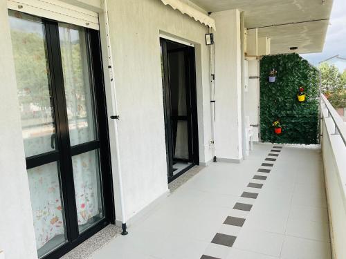 an empty hallway of a building with glass doors at Casa Vacanza Demetra in Marina di Fuscaldo
