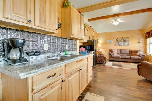 a kitchen with a sink and a counter top at Cabin Getaway in Mountain View with Porch and Grill in Mountain View