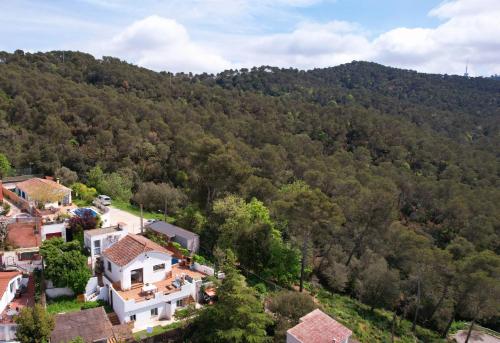 an aerial view of a house in a mountain at Forest Escape near Barcelona in Sant Cugat del Vallès