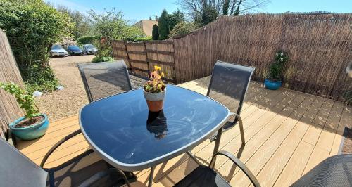 a table with a cone on top of it on a patio at The Snug - for Eurotunnel, North Downs Way & Golfing in Folkestone