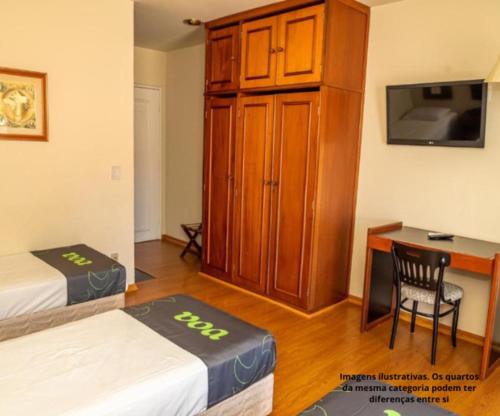 Postel nebo postele na pokoji v ubytování VOA Hotel Caxambu