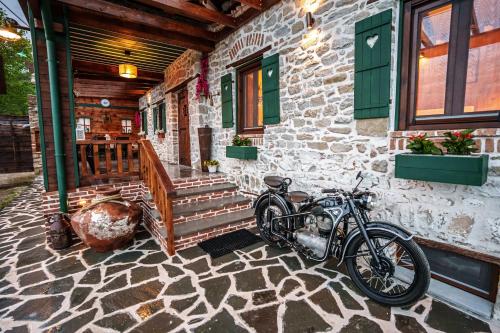 a motorcycle parked on the side of a building at Archontiko Theofanous in Tríkala