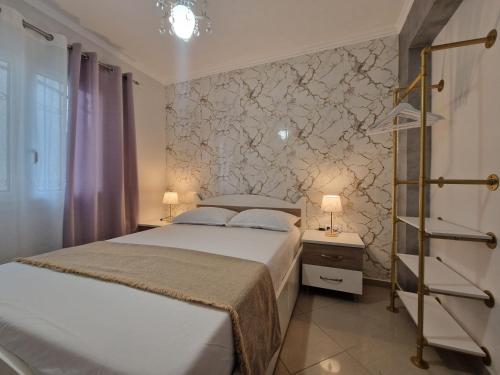 Postel nebo postele na pokoji v ubytování Iro Apartments