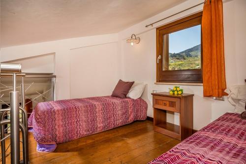 A bed or beds in a room at APT Villa Anna e APT Cantina Vito vicinissimi alla Riserva dello Zingaro