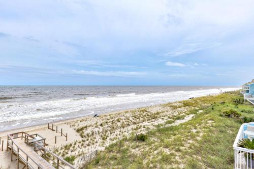 an image of the beach from the balcony of a beach house at Ocean Dunes 306 by Carolina Beach Realty in Kure Beach