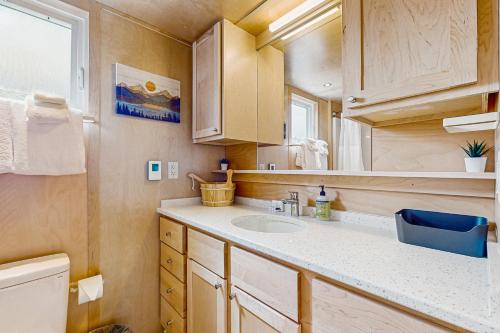 a small bathroom with a sink and a mirror at Cottage Retreat in Colchester
