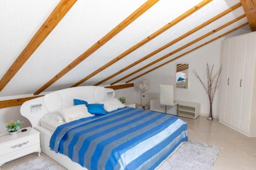 Postel nebo postele na pokoji v ubytování Guest House Aldin