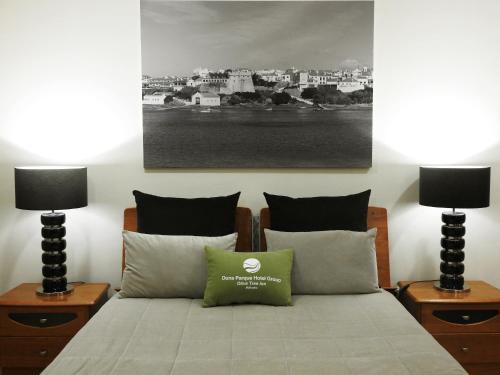 Säng eller sängar i ett rum på Milfontes Guest House - Duna Parque Group