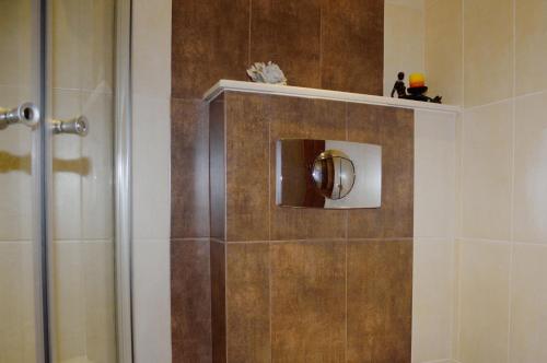 a bathroom with a shower stall with a shower at Villa Diana in Sozopol