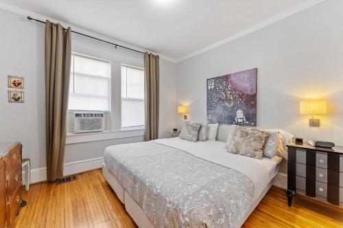 a bedroom with a large bed and a window at Chic 1 BR Units Near Dilworth in Charlotte