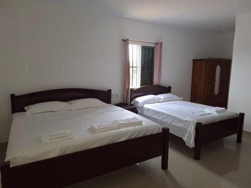 Katil atau katil-katil dalam bilik di Day And Night Hotel Belmopan